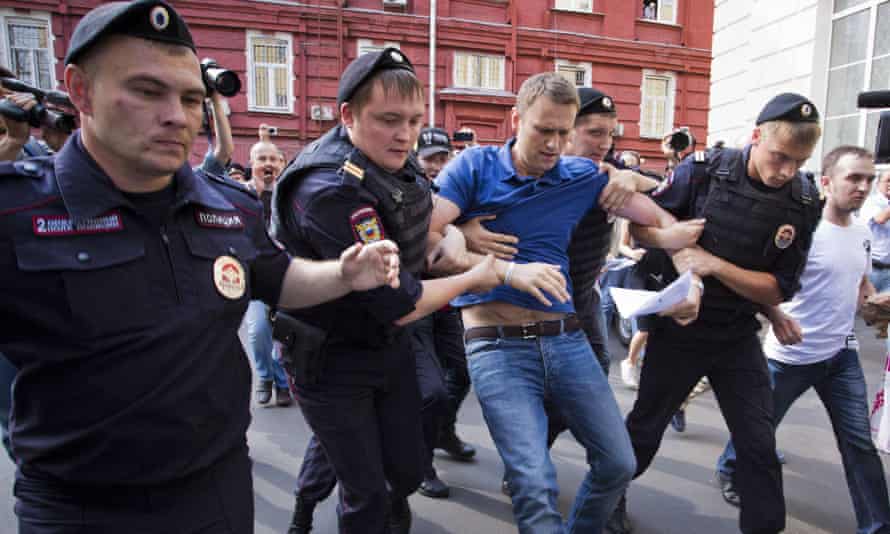 Police officers detain Alexei Navalny in 2013