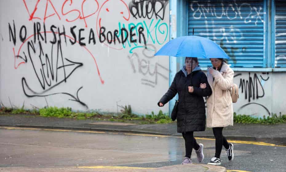 Graffiti in south Belfast references checks between Great Britain and Northern Ireland.