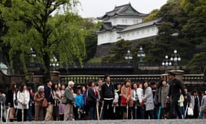 Japanese people and tourists visit the Imperial Palace, where Japan’s Emperor Akihito is attending ritual ceremonies to abdicate