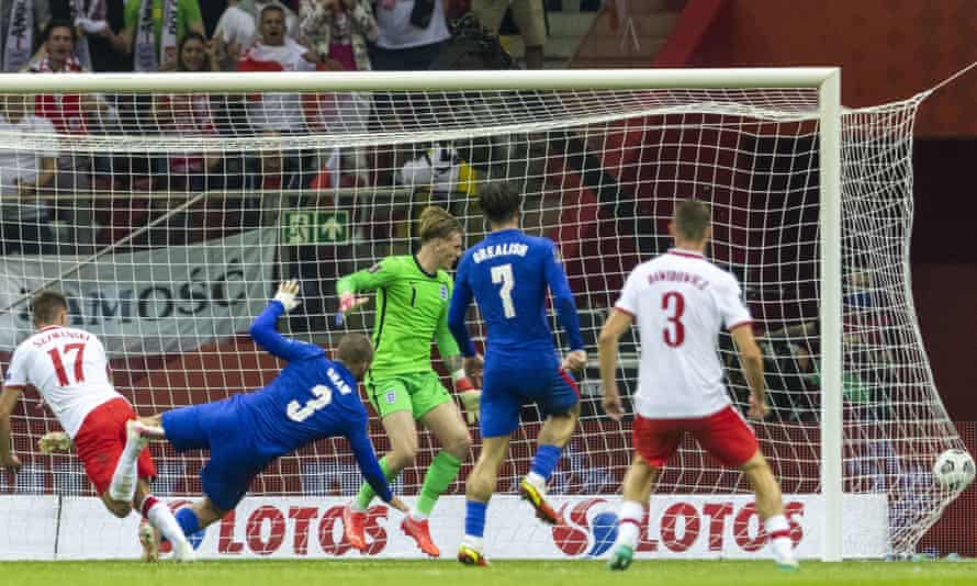 Damian Szymanski heads in Poland's late equaliser against England