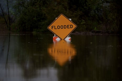 a flood sign during a storm