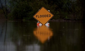 a flood sign during a storm