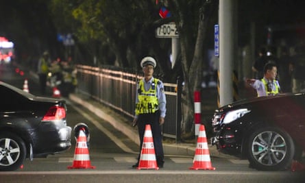 A security officer standing guard near the sports centre on Monday night.