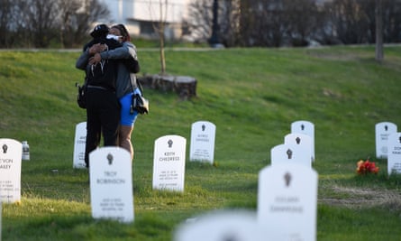 Two people hug at the ‘Say Their Names’ cemetery that memorializes Black Americans killed by police, in Minneapolis.