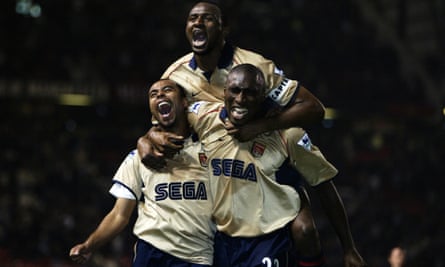 Ashley Cole, Patrick Vieira and Sol Campbell celebrate as  Arsenal beat Manchester United 1-0 at Old Trafford to win the 2001-02 title