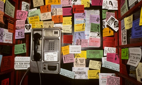 A phone booth full of prostitutes’ business cards in London