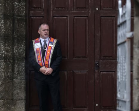 A member of the Orange Order outside Drumcree Parochial Hall