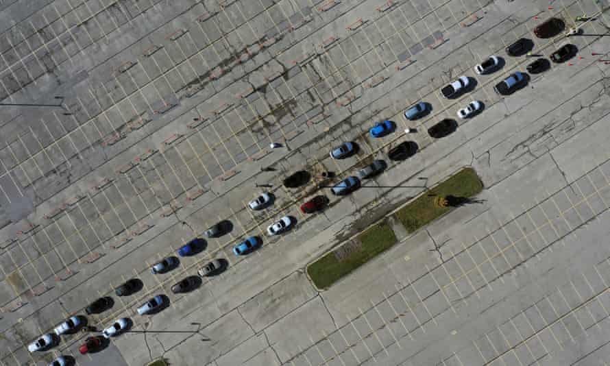 Aerial view of people waiting in their vehicles for Covid-19 tests at a drive-thru testing site in Milwaukee, Wisconsin.