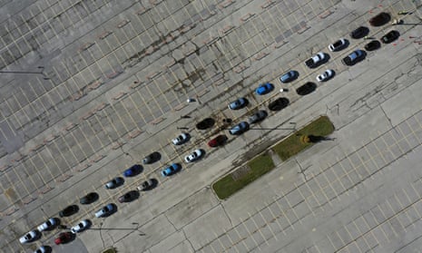 Aerial view of people waiting in their vehicles for Covid-19 tests at a drive-thru testing site in Milwaukee, Wisconsin.