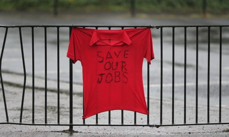 A t-shirt strapped to railings says 'Save our jobs.'