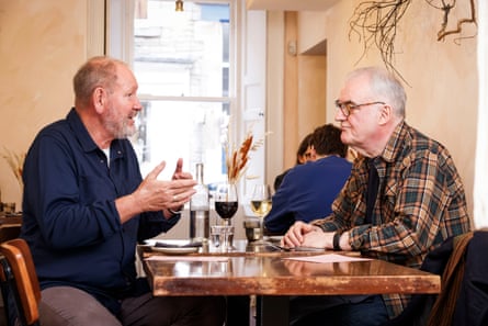 Geoff and Terry chatting at a restaurant table