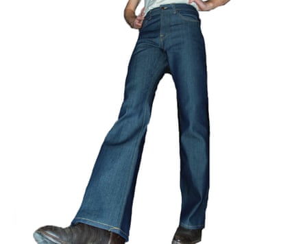 A from below cropped at waist image of a model wearing Nudie Deadstock jeans in blue