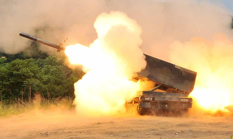 US Multiple Launch Rocket System (MLRS) launches a rocket into the air during a live fire training exercise.