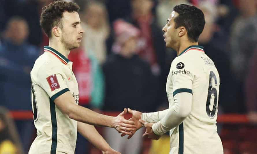 Diogo Jota is congratulated by Thiago Alcântara after scoring.