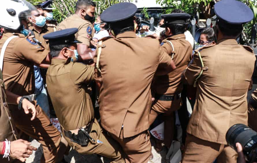 Activists of the Frontline Socialist party (FSP) are taken into police custody for breaching quarantine laws during a protest against the murder of George Floyd, outside the US embassy in Colombo.