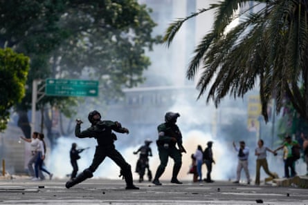 Police hurl gas canister at protesters demonstrating against the official election results last Monday.