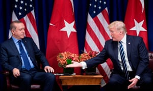 Donald Trump reaches to shake hands with Turkey’s president, Recep Tayyip Erdogan, in New York City on 13 December 2017.
