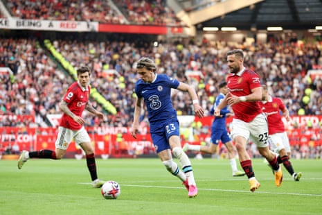 Conor Gallagher battles for possession with Luke Shaw.