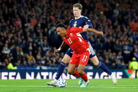 Switzerland’s Dan Ndoye falls to the ground in a clash with Scotland’s Jack Hendry, leading to a free-kick on the edge of the area and a red card for Hendry.
