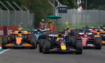 Max Verstappen leads the pack on the opening lap. 