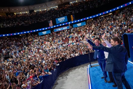 trio wave in front of large crowd