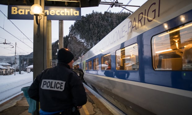 French border police at an Italian train station
