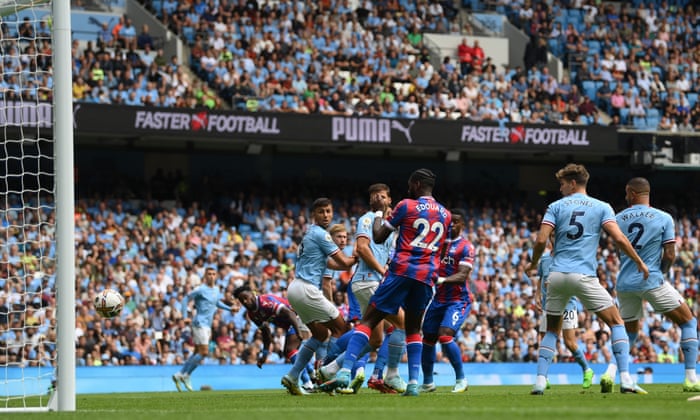 John Stones of Manchester City (second right) scores an own goal to open the scoring and give Crystal Palace the lead.