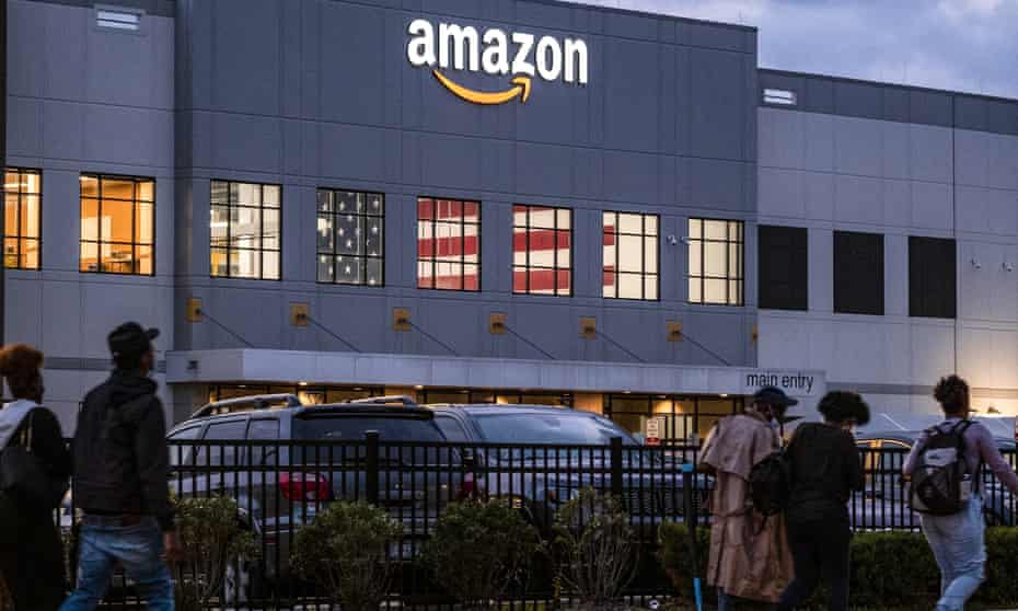 People arrive for work at the Amazon distribution center in the Staten Island borough of New York on Monday, which recently voted to unionize.