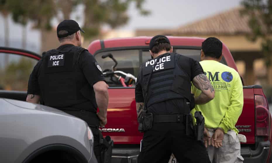 Ice officers detain a man during an immigration sweep in Escondido, California. 