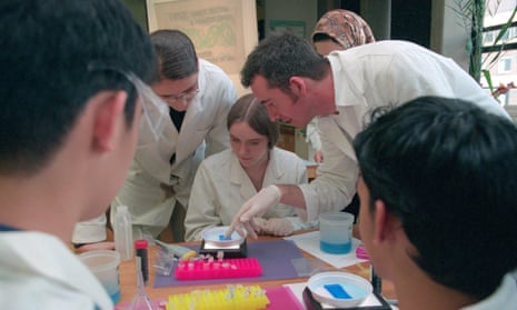 Sixth-form students and teacher in a laboratory during science class