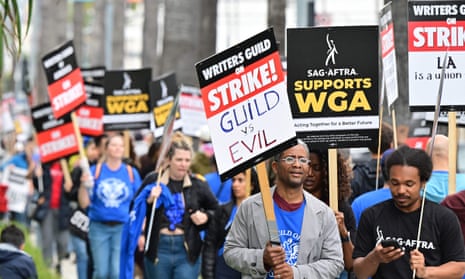 Writers on strike in front of Netflix in Hollywood, California, over pay and working conditions, on 5 May.