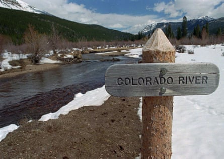 A sign marks the Colorado River as it flows past the Never Summer Mountains in Rocky Mountain national park, Colorado.