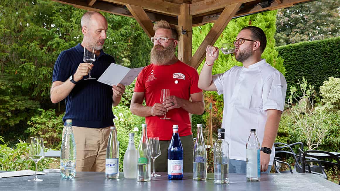 Three men at a water tasting