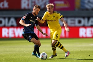 Paderborn’s forward Dennis Srbeny vies with Dortmund’s forward Julian Brandt.