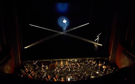 Spotlights cross as the company perform Etudes.
