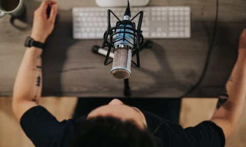 Podcaster behind microphone