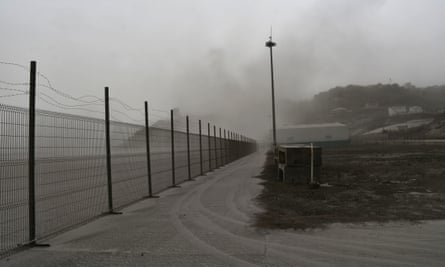 A road is blanketed in volcanic ash at the airport in Kingstown, on St Vincent.
