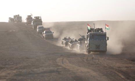 Iraqi Kurdish regional government peshmerga forces take positions as they start to attack Isis targets in Bashiqa district
