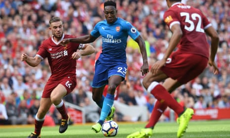 Arsenal’s Danny Welbeck, who generally struggled to get into the game, takes on Jordan Henderson at Anfield on Sunday.