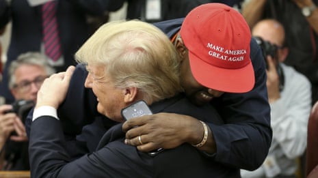 Kanye says 'I love this guy right here' as he walks over and gives Trump a hug – video
