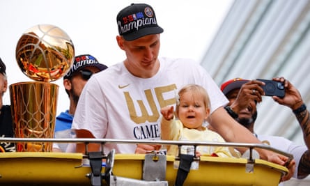 Nikola Jokić with his daughter Ognjena during Thursday’s championship parade