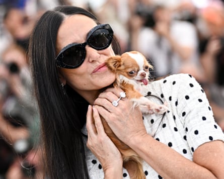Demi Moore holding a dog