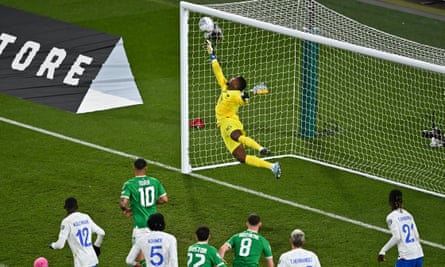 Mike Maignan saves a late header from Nathan Collins (unpictured) to deny Ireland a point.