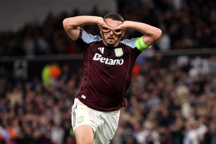 John McGinn puts his hands over his eyes in celebration after scoring