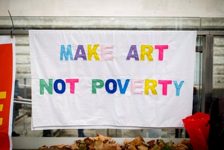 A ‘Make art not poverty’ placard