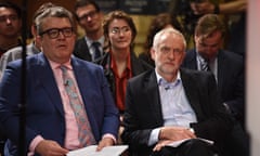 Britain's main opposition Labour Party leader Jeremy Corbyn (R) sits with deputy leader Tom Watson (L) in the audience during a general election campaign event in Kingston upon Hull, northern England on May 22, 2017.