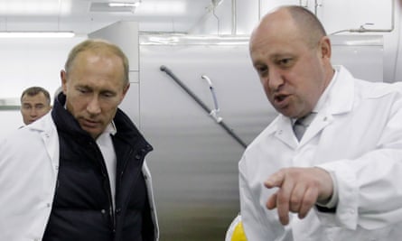 Yevgeny Prigozhin, right, shows Vladimir Putin his school lunch factory outside Saint Petersburg in 2010.