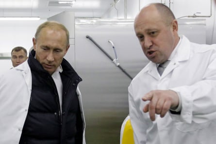 Vladimir Putin and Yevgeny Prigozhin in a factory in St Petersburg in 2010 