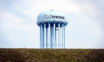 A water tower reads "Flint strong"