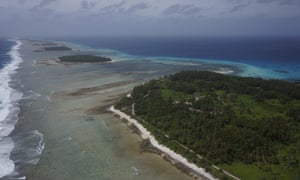 Aerial photograph of Kwajalein Atoll showing its low-lying islands and coral reefs.